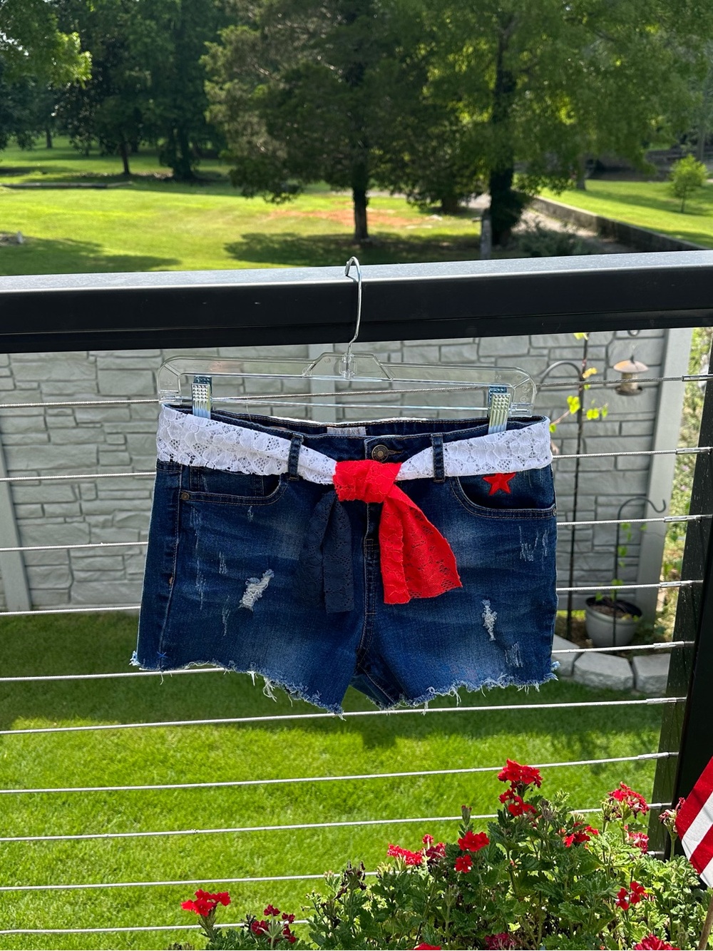 Women’s Dark Blue Distressed Denim Shorts with White Lace Waist and Red Tie
